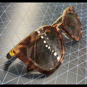 Prada SPR 53S gold cateye sunglasses